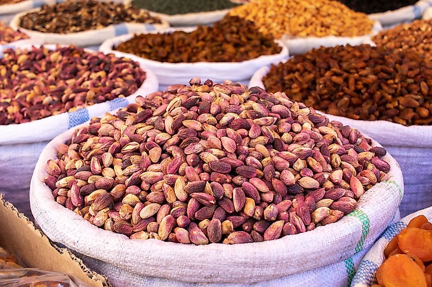 Bags with fresh pistachios and other fruits and nuts