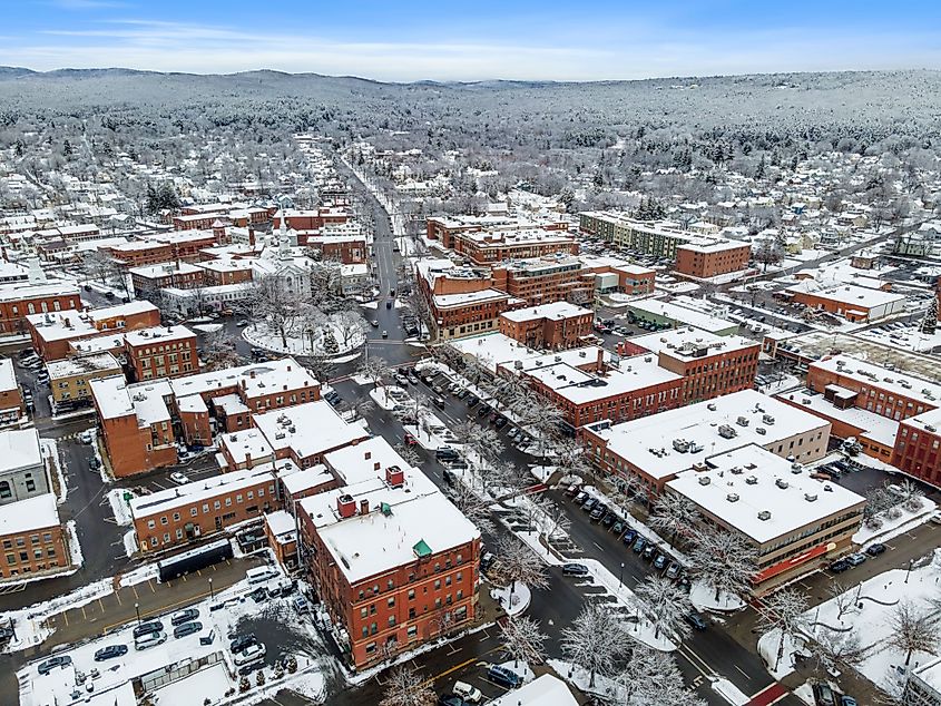 An aerial view of residential buildings and roads covered in the snow in Keene, New Hampshire.