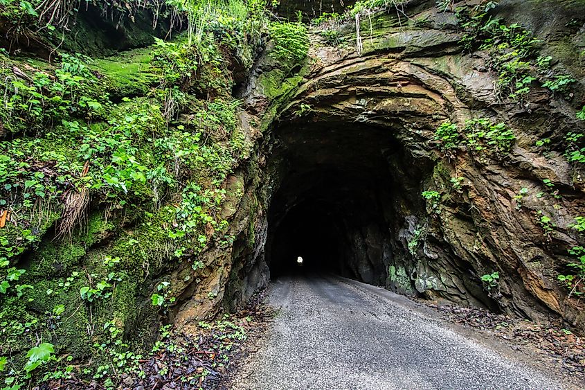 The 900-foot Nada Tunnel in the Red River Gorge of Kentucky. Open to traffic, the harrowing one-way tunnel is a thoroughfare for two-way traffic.