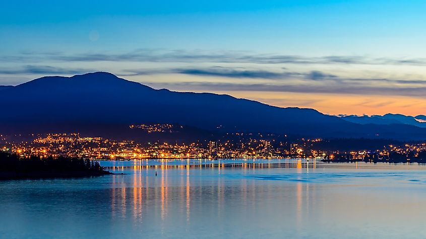 Tranquil sunset and evening illuminations of the beautiful town of Nanaimo on Pacific Ocean in Vancouver, Canada. 