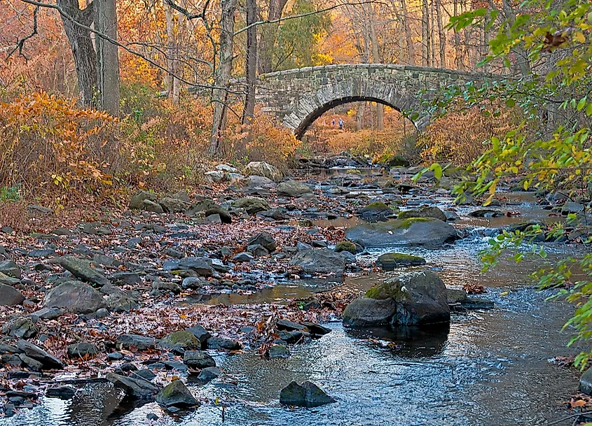 Stone arch bridge over the Pocantico River in Rockefeller State Park Preserve, Sleepy Hollow, NY, USA.