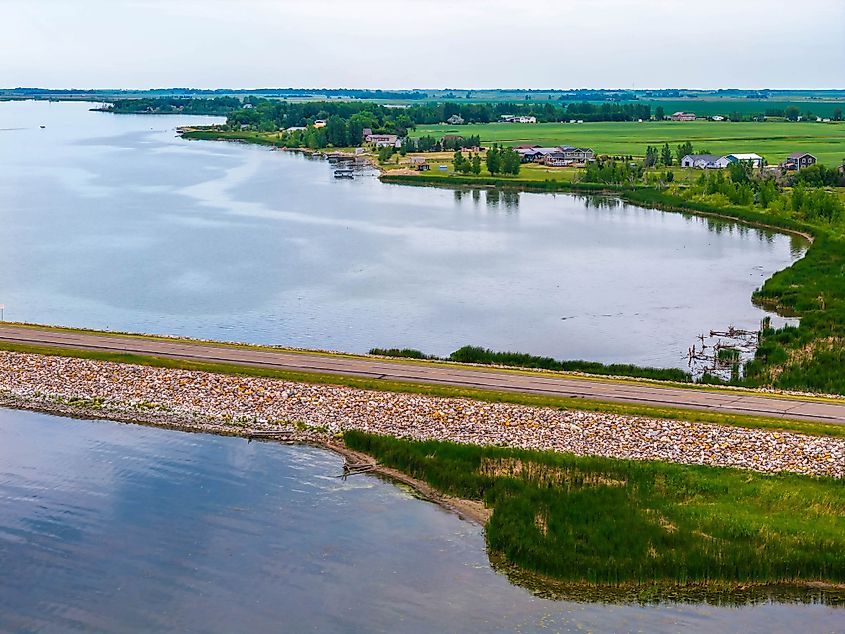 A scenic road extending into Devils Lake, North Dakota