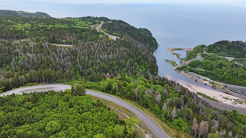 Aerial view of Fundy Parkway in New Brunswick, Canada, with forested coastline along the Bay of Fundy