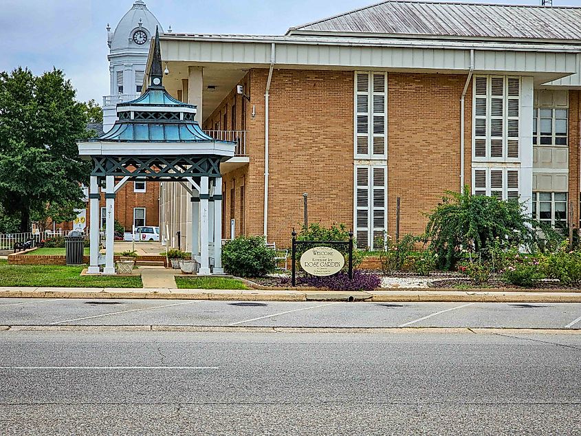 Historic downtown in Monroeville, Alabama lined with old buildings, historical markers, and notable landmarks