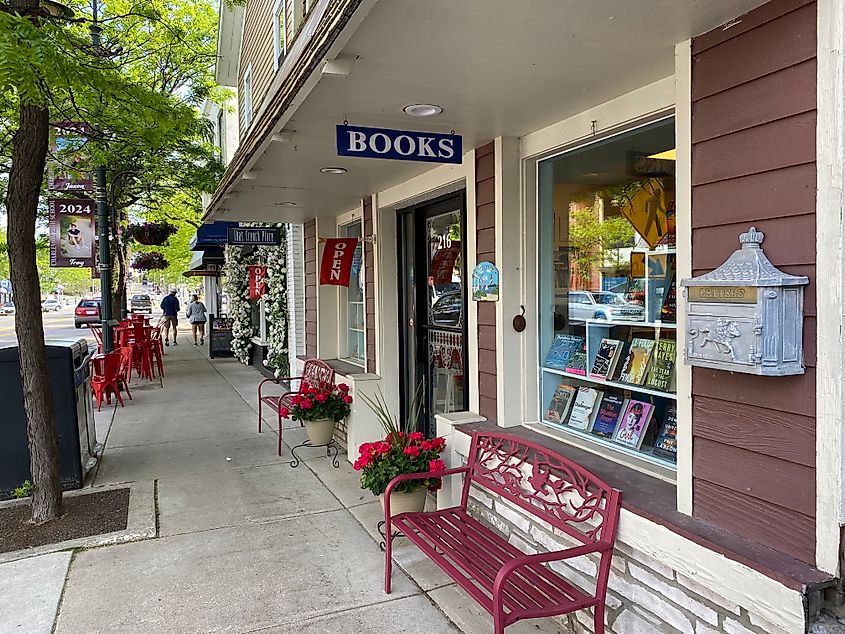 A red bench and book store amidst a charming small-town core. 