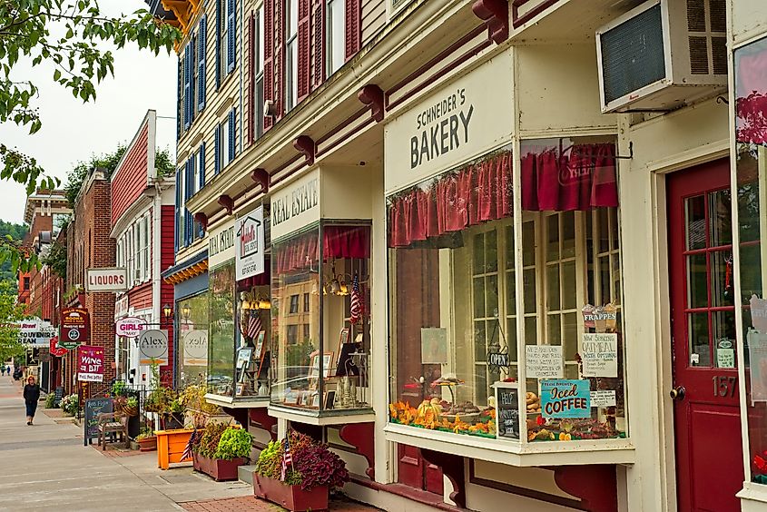 Shops, eateries, and baseball-themed attractions lining the sidewalk on Main Street in charming Cooperstown, New York.