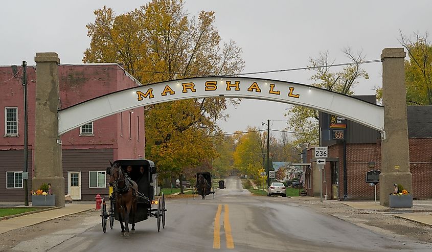 Horse-drawn Amish buggy under the Arch in downtown Marshall.