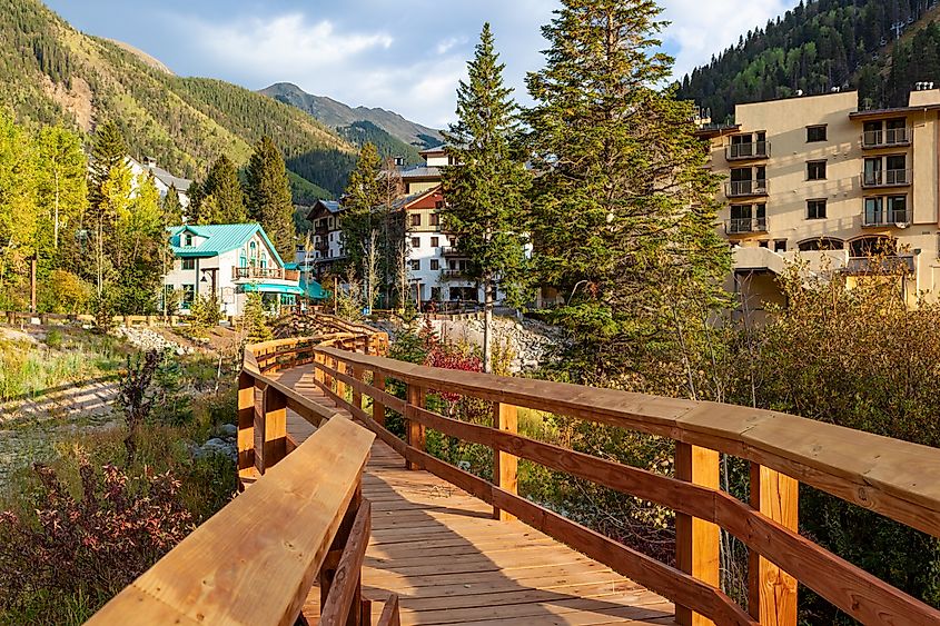 Boardwalk in Taos Ski Valley, New Mexico, surrounded by vibrant fall foliage