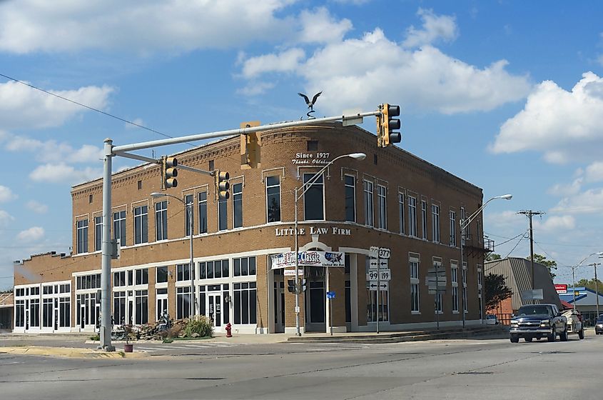 Old building at a street intersection that houses the Little Law Firm since 1927 in Madill. Editorial credit: RaksyBH / Shutterstock.com