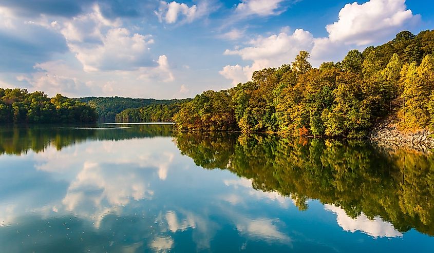 Clouds and trees reflecting in Prettyboy Reservoir, Baltimore County, Maryland.