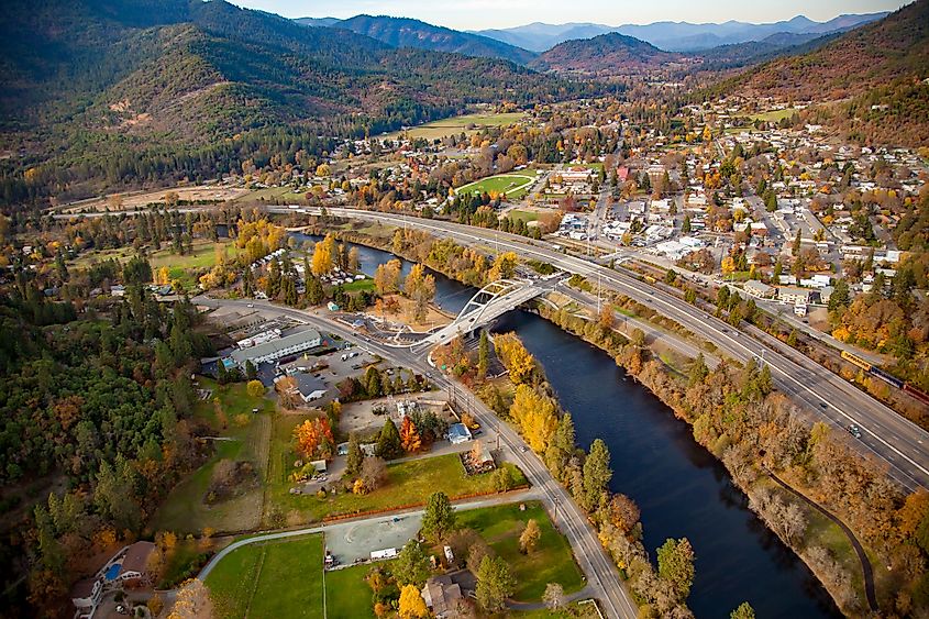 Aerial view of Rogue River, Oregon showing Interstate Highway I-5 and the concrete arch bridge over the Rogue River