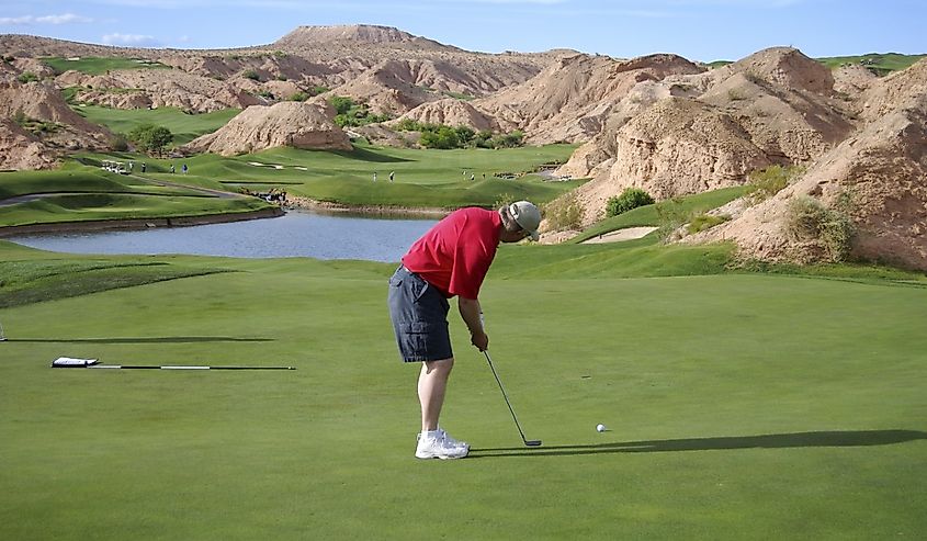 Man putting on beautiful golf course (Wolf Creek Golf Course in Mesquite, Nevada)