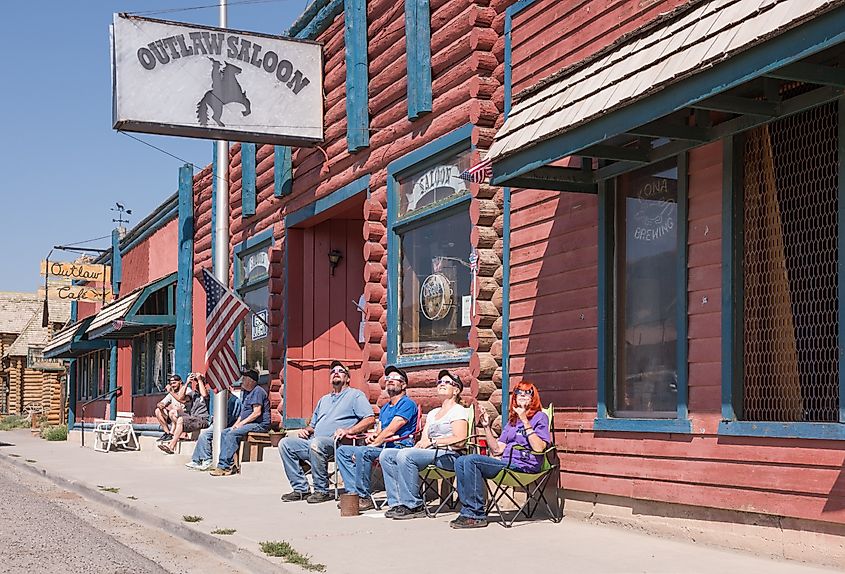 Group of people watching the solar eclipse in front of the Outlaw Saloon in Dubois, Wyoming.