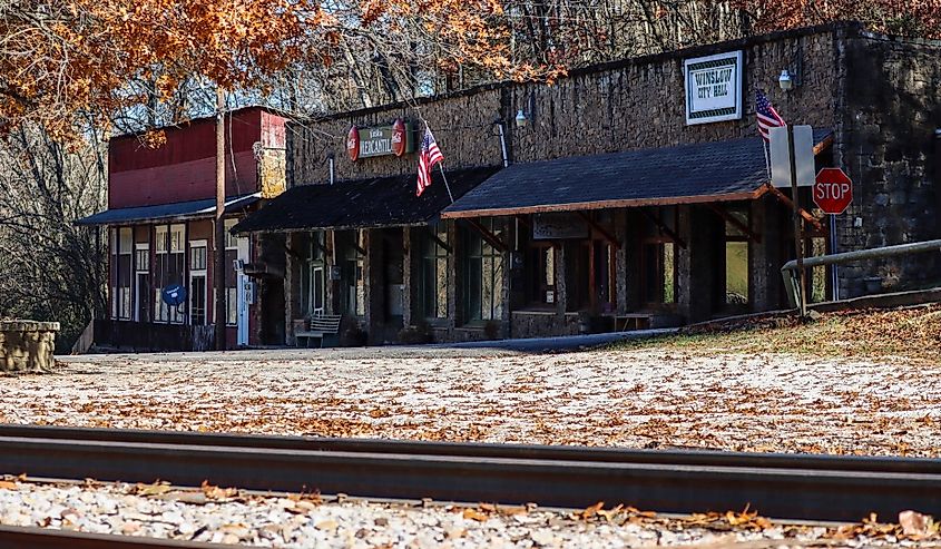 Picture of downtown Winslow Arkansas in the Fall with railroad tracks in the foreground.