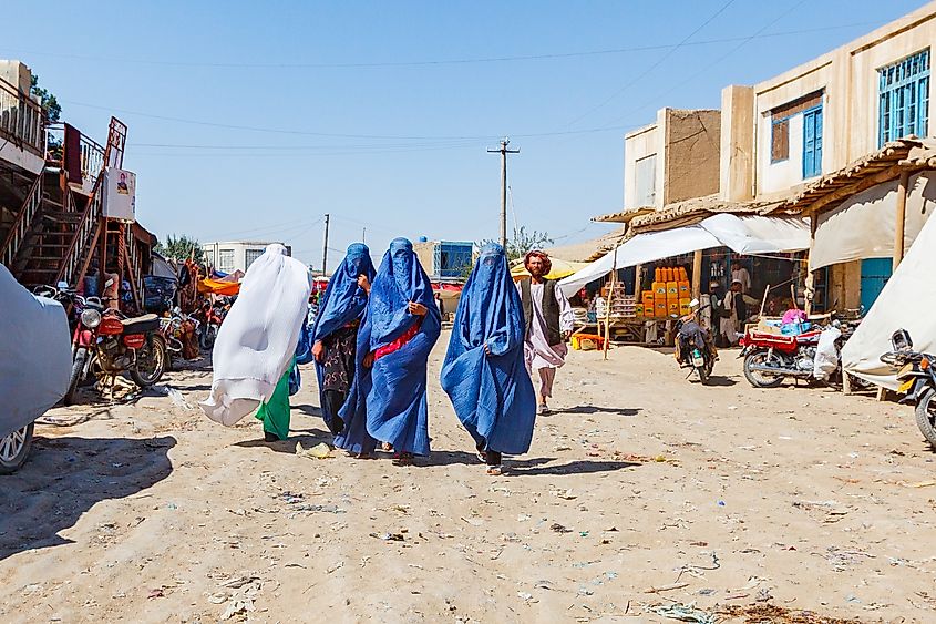 A group of Afghan women wearing burka, walks in the street to go to the market. Editorial credit: Pvince73 / Shutterstock.com