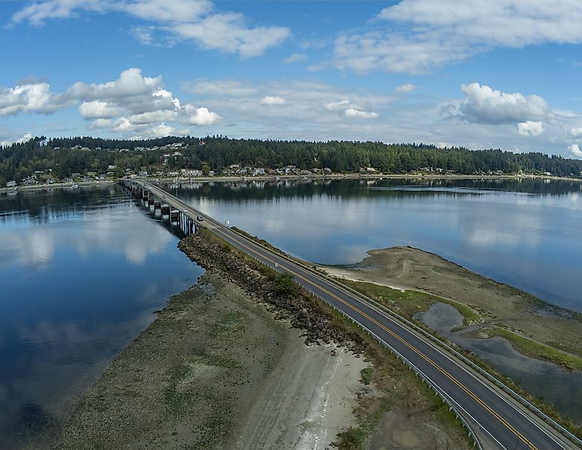 Aerial photograph showcasing the picturesque Fox Island Bridge connecting Gig Harbor and Fox Island in Washington State.
