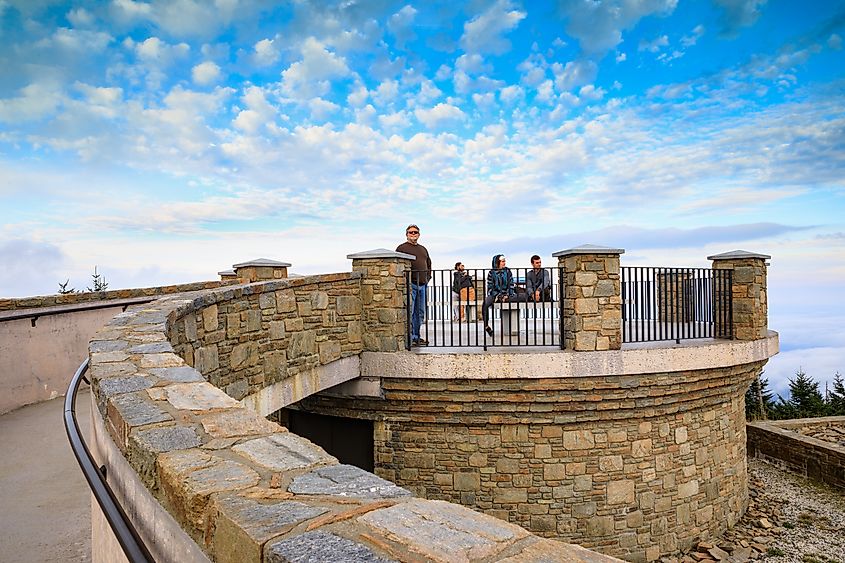 Mt. Mitchell State Park observation deck with unknown tourists at the highest peak of the Appalachian Mountains in North Carolina, located in Burnsville. Editorial credit: Cvandyke / Shutterstock.com