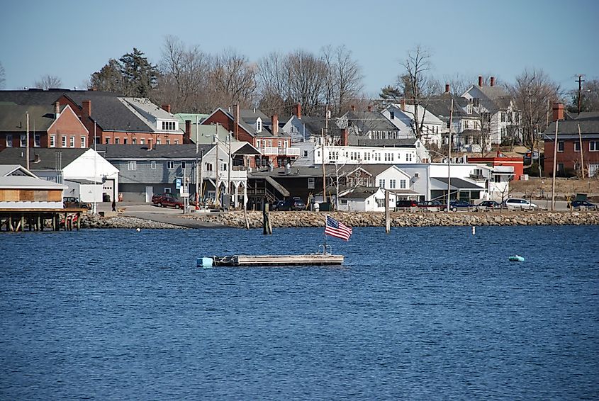 Damariscotta maine across river with flag on float.