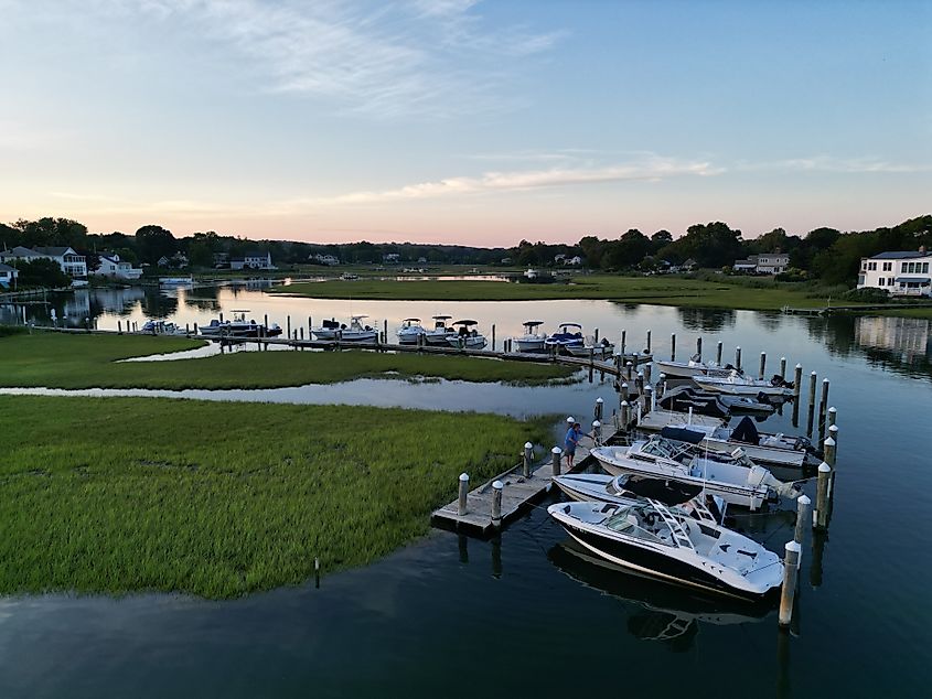 A port with boats and coastal houses at sunset in Old Saybrook, Connecticut