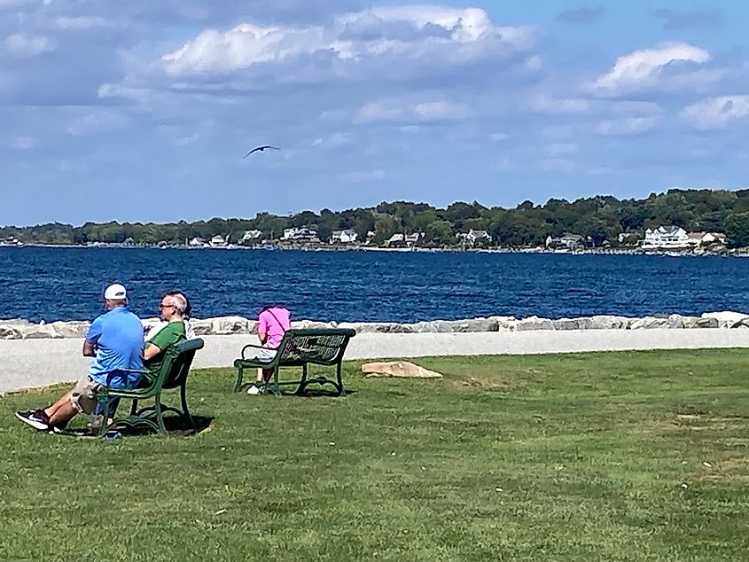 People enjoying the view of the Atlantic Ocean in Bristol, Rhode Island.