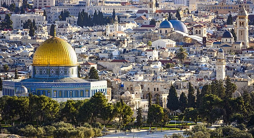 An elevated view of the Jerusalem skyline from the Mount of Olives, showcasing the stunning Dome of the Rock (Al-Aqsa Mosque) in the heart of the Old City.