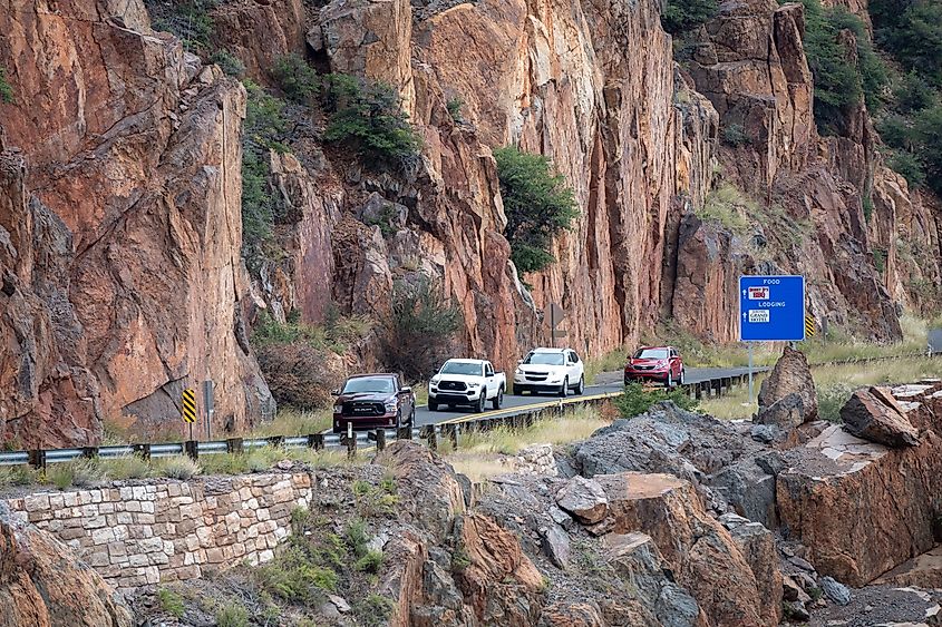 Line of four cars stopped on a two-lane mountain stretch of AZ-89 outside Jerome, Arizona