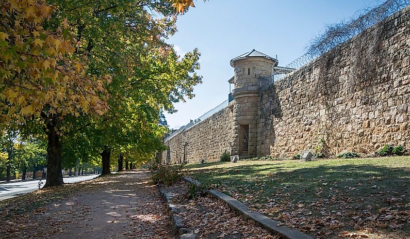 View of the stone gaol wall and lookout tower in the rural town of Beechworth, Victoria, Australia