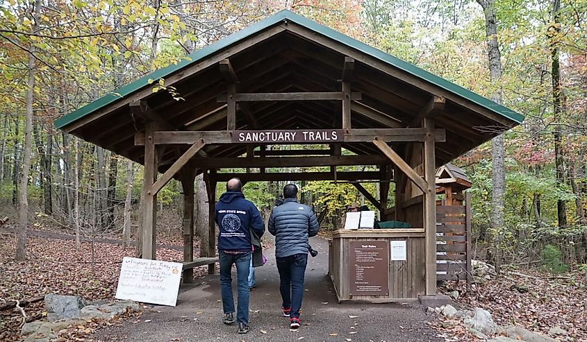 Visitors by the entrance into Sanctuary Trails by Hawk Mountain in Hamburg, Pennsylvania.