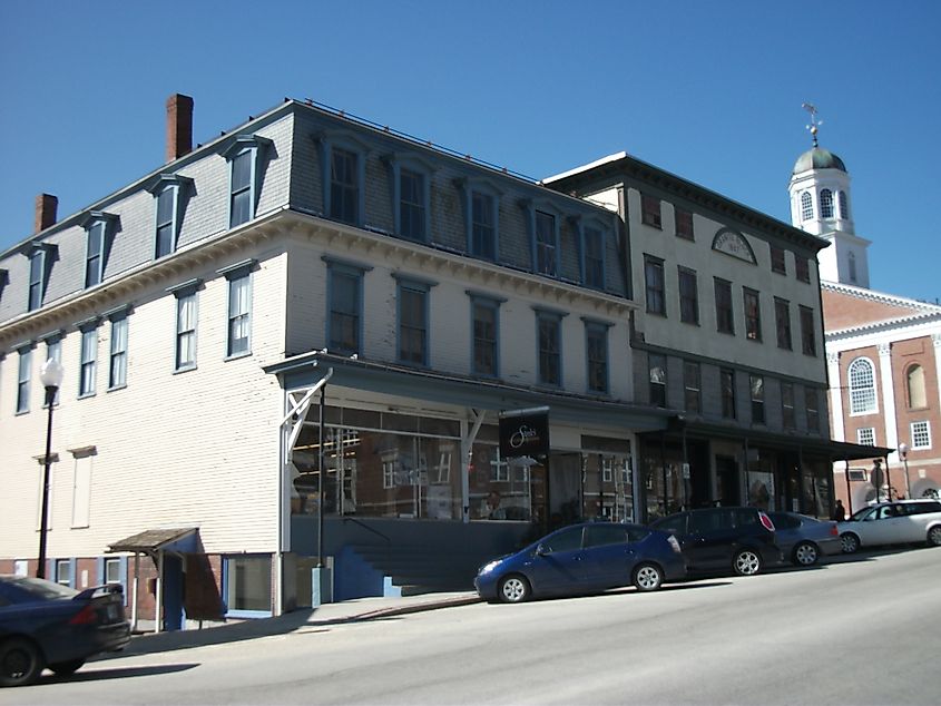 Street view of Peterborough, New Hampshire, featuring charming local shops, historic buildings, and tree-lined streets in a quaint small-town setting.