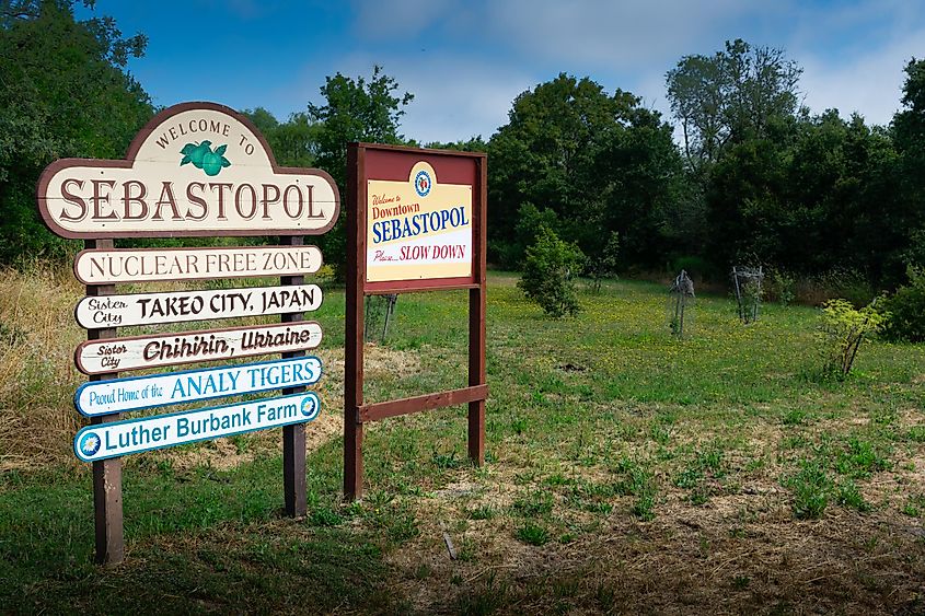 ‘Welcome to Sebastopol’ road sign with ‘Nuclear free zone’ slogan near city limit signpost location - Sebastopol, California