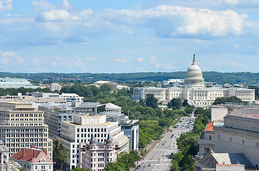 An aerial view of Pennsylvania Avenue in Washington D.C. with federal buildings including the US Archives Building, Department of Justice, FBI Headquarters and the US Capitol Building