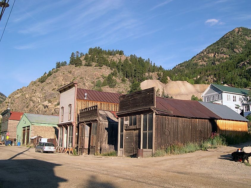 A street view in Silver Plume, Colorado, showcasing historic 19th-century buildings with rustic wooden and brick facades.