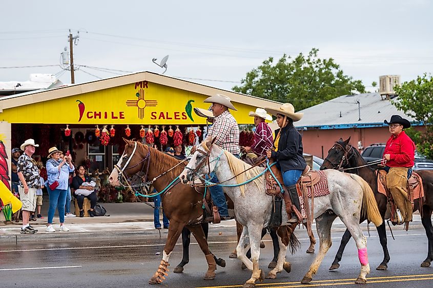 Local farm and ranch workers riding horses in the parade during the annual Hatch Chile Festival.