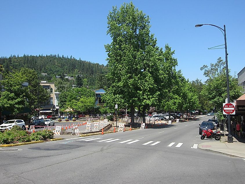 Ashland, Oregon: People walking to the shops with vehicles parked on the streets, via Nature's Charm / Shutterstock.com