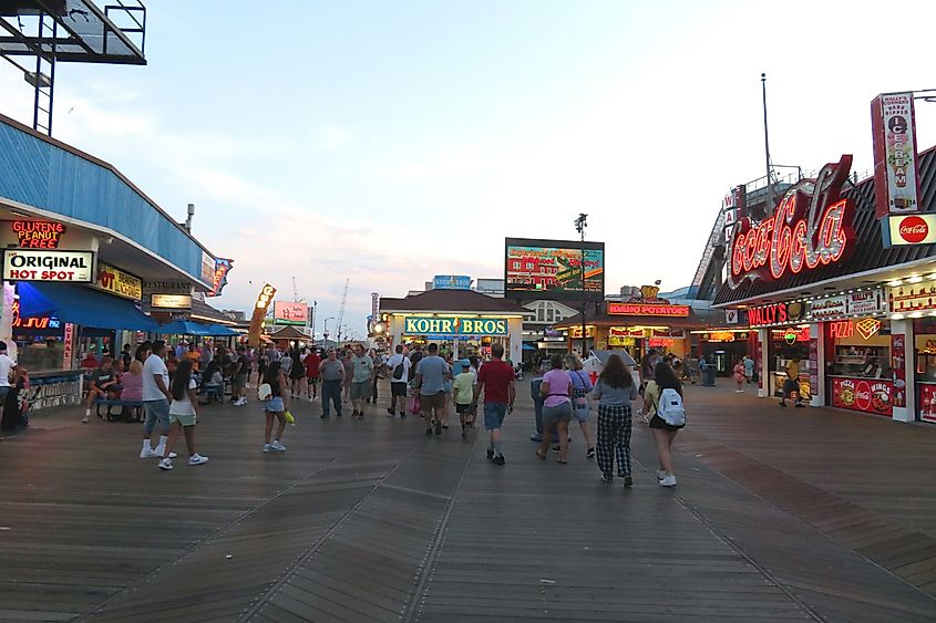 Dusk falls on the classic, picturesque boardwalk in the seashore town of Wildwood, New Jersey, and the colorful lights come on. Editorial credit: Bruce Alan Bennett / Shutterstock.com