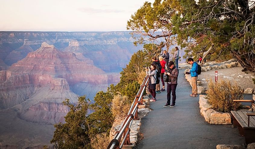 Tourists watch The sunset from Mohave point overlook view of Grand Canyon South Rim