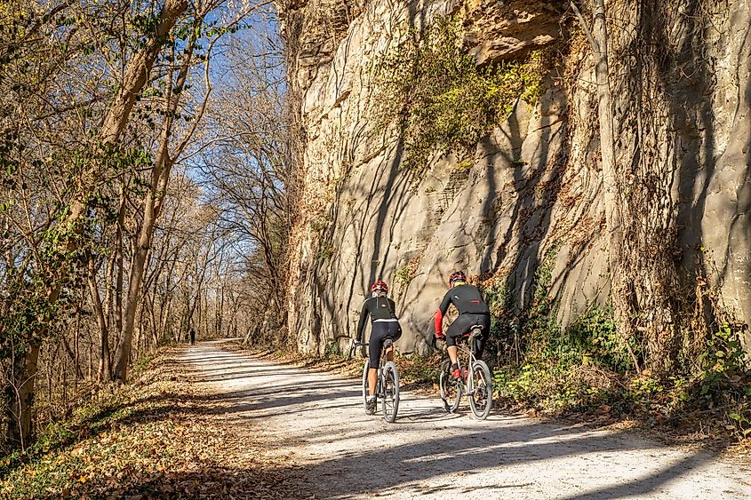 A couple of cyclists on Katy Trail in late November scenery. Editorial credit: marekuliasz / Shutterstock.com