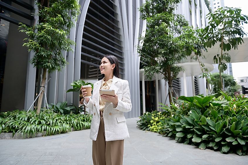 A young businesswoman working in the city downtown of Singapore