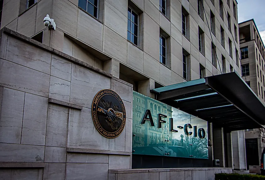American Federation of Labor and Congress of Industrial Organizations (AFL-CIO) logo on glass wall at the entrance to their national headquarters building. Editorial credit: RozenskiP / Shutterstock.com