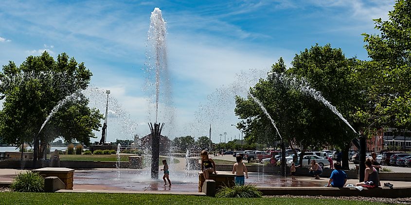  Children beating the heat by playing in the fountains at Riverfront Park in Muscatine.