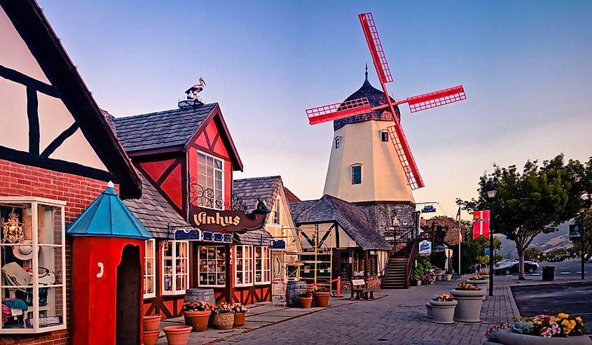 Danish street of Solvang. Cobblestone road and windmill. 