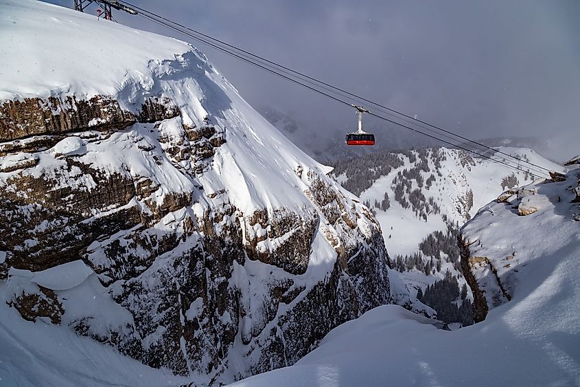 The slopes of Jackson Hole Ski Resort, surrounded by the snow-covered peaks of the Teton Mountains in Wyoming.