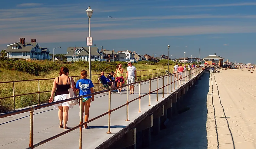 People strolling the oceanfront boardwalk in Spring Lake, New Jersey