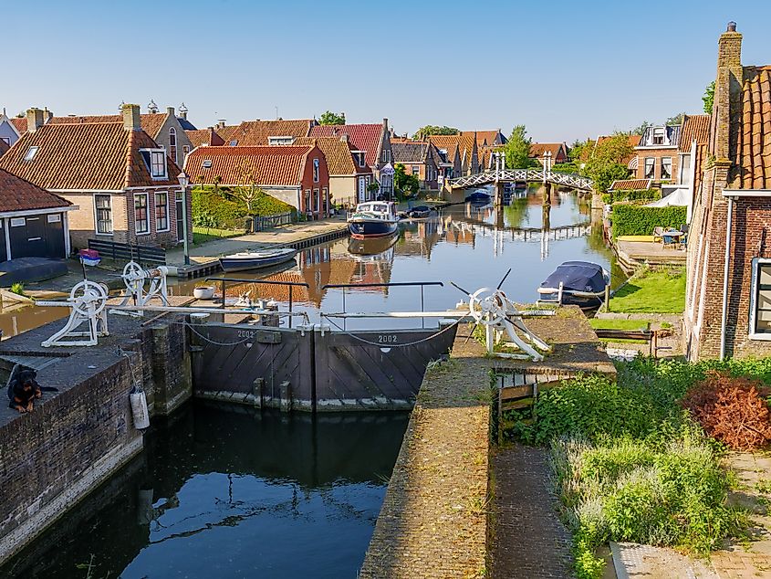 Lock and Zijlroede canal in the historic old town of Hindeloopen, the Netherlands