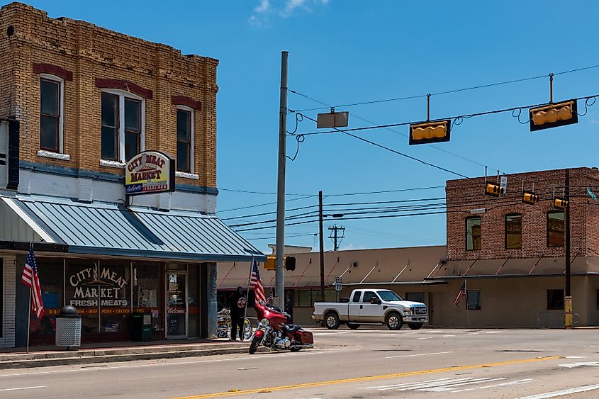 Giddings, Texas - June 13, 2014: Street scene in the city of Giddings in the intersection of U.S. Highways 77 and 290 in Texas, USA.