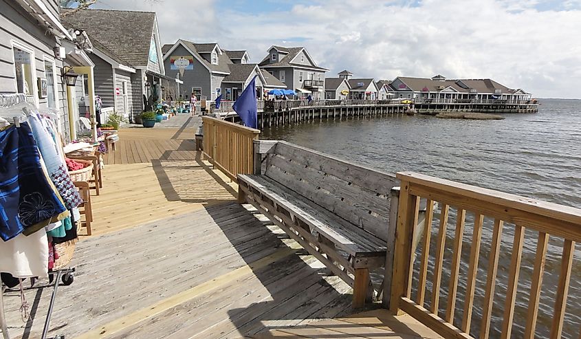 View of people and vacation homes on the beach as seen from the Rodanthe Pier in the Outer Banks