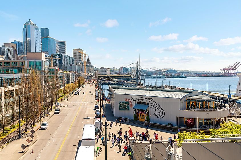 View of Alaska Way, ,the main street along the Seattle Waterfront area near Pikes Place market, with the Great Ferris Wheel and Safeco Field in view.