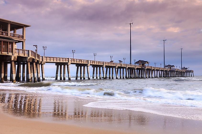 Jennette's fishing pier is an all concrete, 1000 foot long iconic landmark on the shores of the Atlantic Ocean in Nags Head, North Carolina NC.