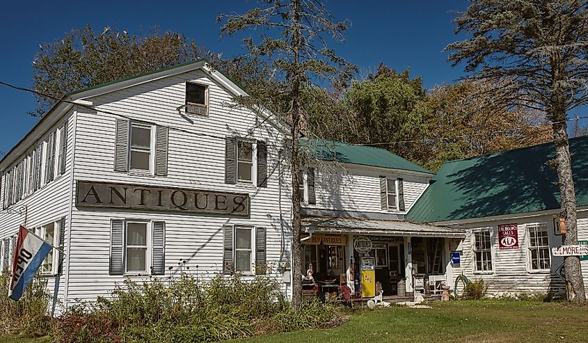 Exterior of Steam Mill Antiques historic farmhouse in the White Mountains of Maine in Bethel, Maine.