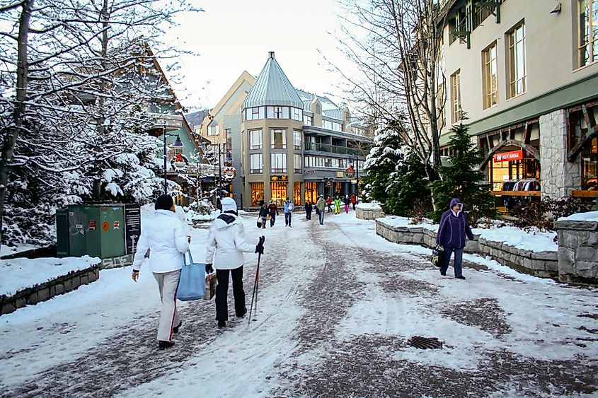 Whistler, BC / Canada. Skiers at Whistler village in the winter. Editorial credit: Marcelo Rodriguez / Shutterstock.com